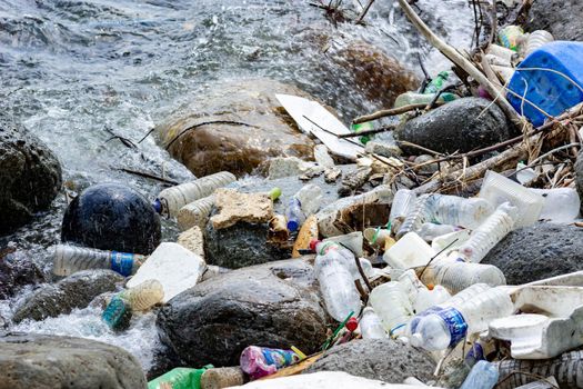 Plastic pollution being thrown on waters damaging the environment and killing the marine life