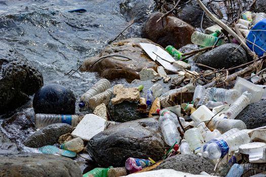 Plastic pollution being thrown on waters damaging the environment and killing the marine life