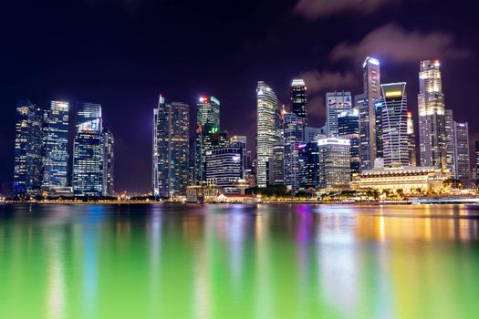 Night cityscape skyline photo of Singapore Central Business District and Financial Centre. Long exposure photo. Singapore, April 14, 2018