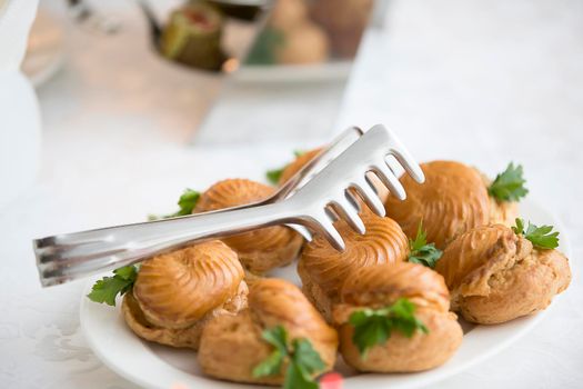 Buffet Dish. Choux pastry on the table