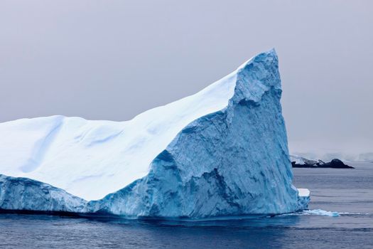 Antarctica landscape - iceberg floating in the sea