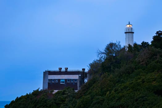Lighthouse in Genoa at dusk. Genoa, Liguria, Italy.
