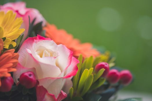 Close up of tender pink rose in a floral bouquet