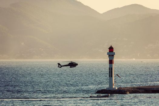 Lighthouse and landing helicopter in Cannes. Cannes, Provence-Alpes-Cote d'Azur, France
