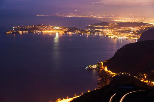 Distant view of Saint Jean Cap Ferrat and Nice at sunset seen from Monaco. Saint Jean Cap Ferrat, French Riviera, France.