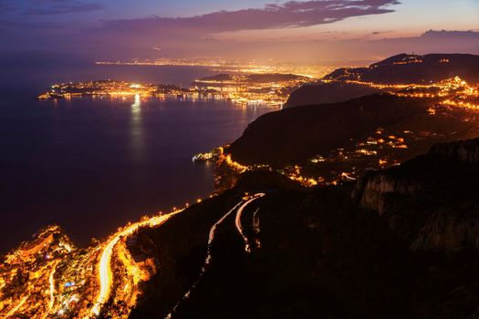 Distant view of Saint Jean Cap Ferrat and Nice at sunset seen from Monaco. Saint Jean Cap Ferrat, French Riviera, France.