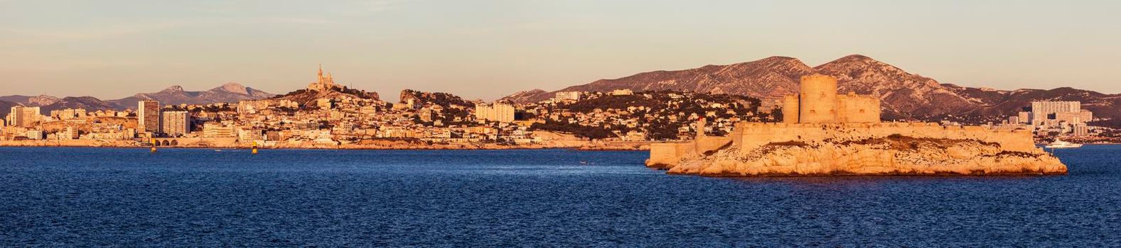 Marseille panorama from Frioul archipelago seen at sunrise. Marseille, Provence-Alpes-Cote d'Azur, France.