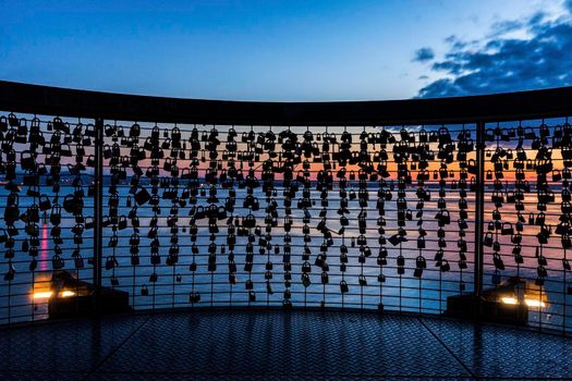 Love locks and Lake Constance in Friedrichshafen. Friedrichshafen, Baden-Wurttemberg, Germany.