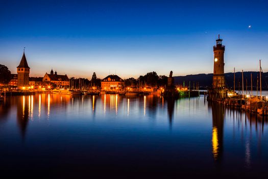 Lindau Lighthouse seen before sunrise. Lindau, Bavaria, Germany.