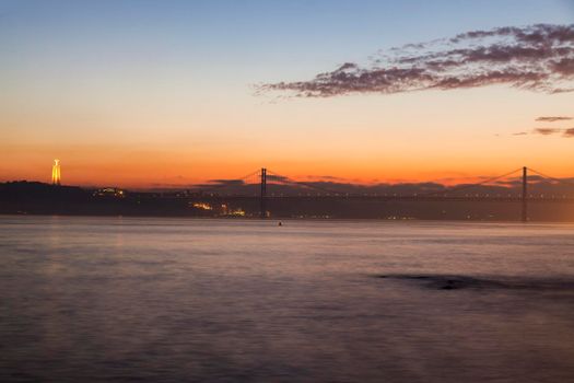 25th of April Bridge and Cristo Rei Statue in Lisbon. Lisbon, Portugal.