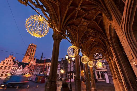 Grote Markt and arches of city hall in Mechelen at sunrise. Mechelen, Flemish Region, Belgium