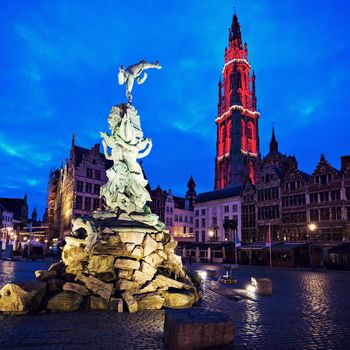 Brabo Fountain and Cathedral of Our Lady on Grote Markt in Antwerp. Antwerp, Flemish Region, Belgium