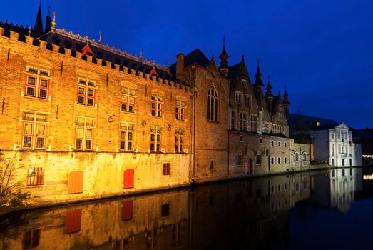 Houses and canals in Bruges at night. Bruges, Flemish Region, Belgium