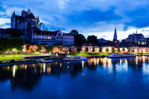 Auxerre along Yonne River at night. Auxerre, Burgundy, France