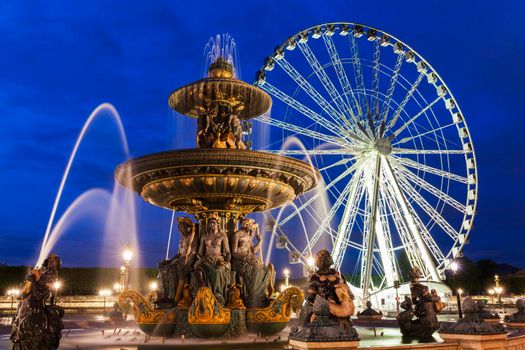 Fontaine des Fleuves and Ferris Wheel on Place de la Concorde in Paris. Paris, France.