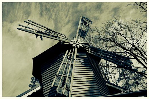 Retro colorless postcard old mill