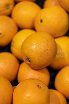 Bunch of fresh tangerines oranges on market