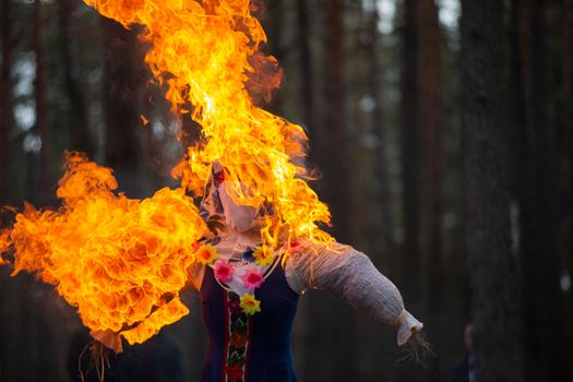 Burning straw stuffed carnival, a symbol of winter and death in Slavic mythology, pagan tradition. Religious and folk festival of the East Slavic people.