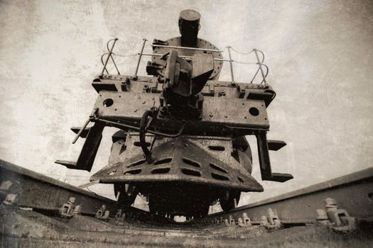 Photo of an old train in black and white with scuffs and scratches
