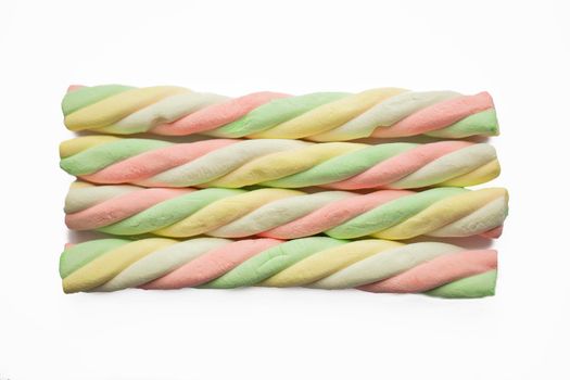 Marshmallow sticks. Sweets multi-colored sweets from protein air mass.