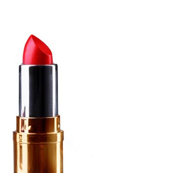 Red lipstick in a gold case. Cosmetics for lips. Makeup.