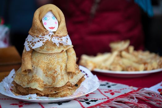 Maslenitsa holiday.Pancake doll. Doll baked from pancakes for the holiday Maslenitsa.