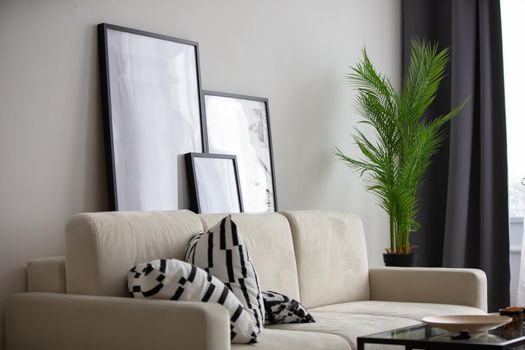 Living room. Wall with a sofa. Part of the interior of the room.