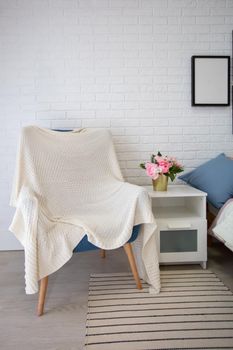 Vertically part of the room with an armchair.