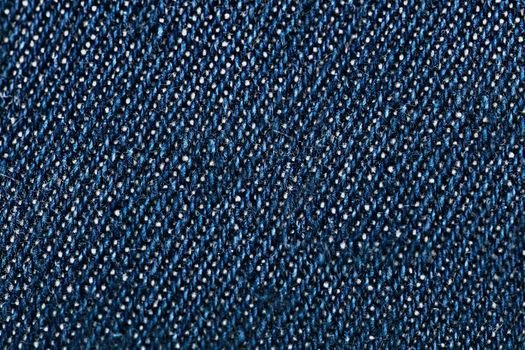 Uniform texture of denim dark blue fabric