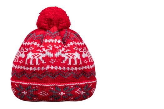 Red winter knitted hat with patterns on a white background.