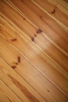 Close-up diagonal texture of a wooden floor.