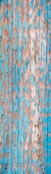 Vertical wooden turquoise background.Blue ragged board.