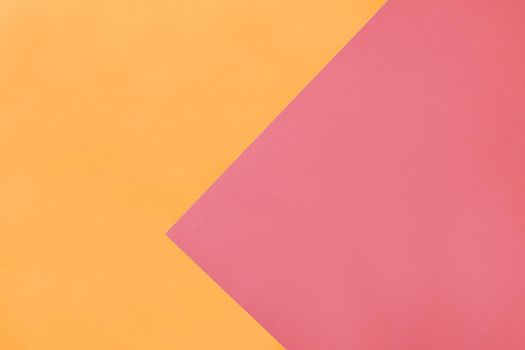 Modern backdrop with triangles overlay layers of pink and orange colors. Pastel shades background for text or print design