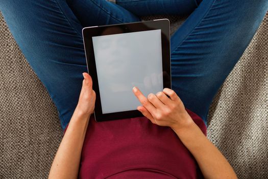 Cropped shot of female hands working with a tablet, tablet with copy space 