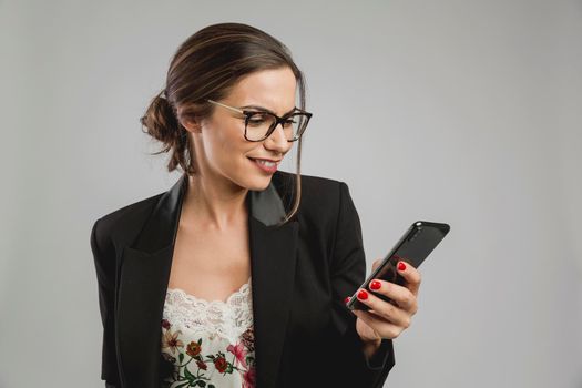 Beautiful woman checking her cellphone