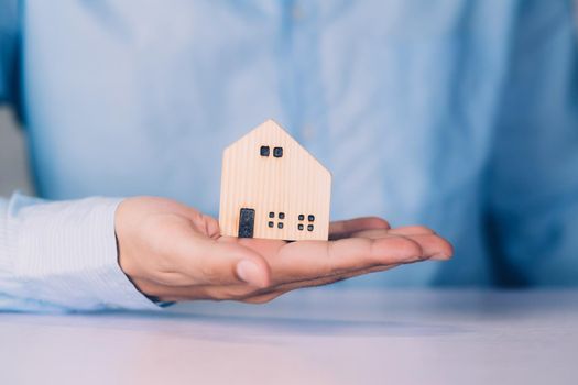 Insurance house for security and care, real estate, costs and loan and mortgage, protection of home and advisor with investment in residential, assurance of property for finance, business concept.