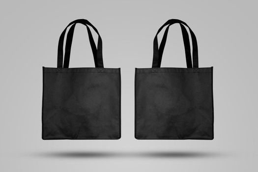 Mockup black tote bag fabric for shopping, mock up canvas bag textile with reusable.