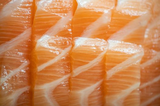 Close up raw fresh Salmon fish meat filleted piece.