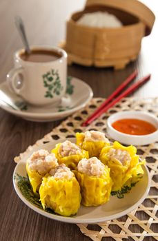 Siu Mai - Chinese steamed pork dumplings in bamboo steamers.