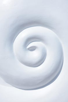 abstract spiral shape made from concrete, white spiral shaped