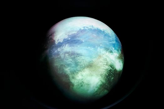 Image of planet earth on black background. Colourful, blue sea clouds