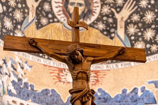 wooden crucifix with hand carved jesus in a church