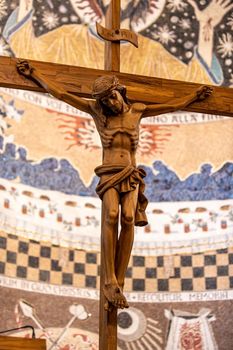 wooden crucifix with hand carved jesus in a church