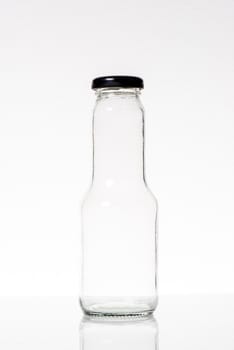 clear glass bottle isolated on white background