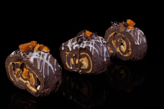 Small chocolate cakes on a black background.Brownie