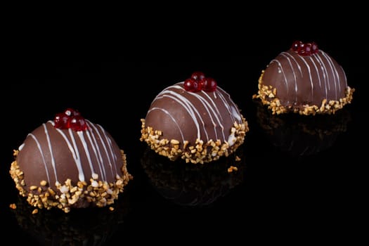 Small chocolate cakes on a black background.Brownie