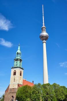 The famous TV Tower and the Marienkirche at Alexanderplatz in Berlin, Germany