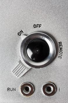 closeup on-off switch in vintage style on the vintage electronic equipment
