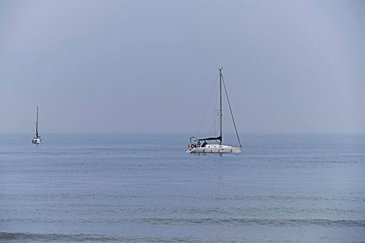 Two sailboats sailing in calm waters, group, sea, ocean, no contrast