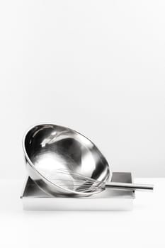 isolated stainless Whisk and stainless bowl on white background